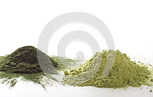 Spirulina and barley grass raw powder on white background Ã¢â¬â heap.